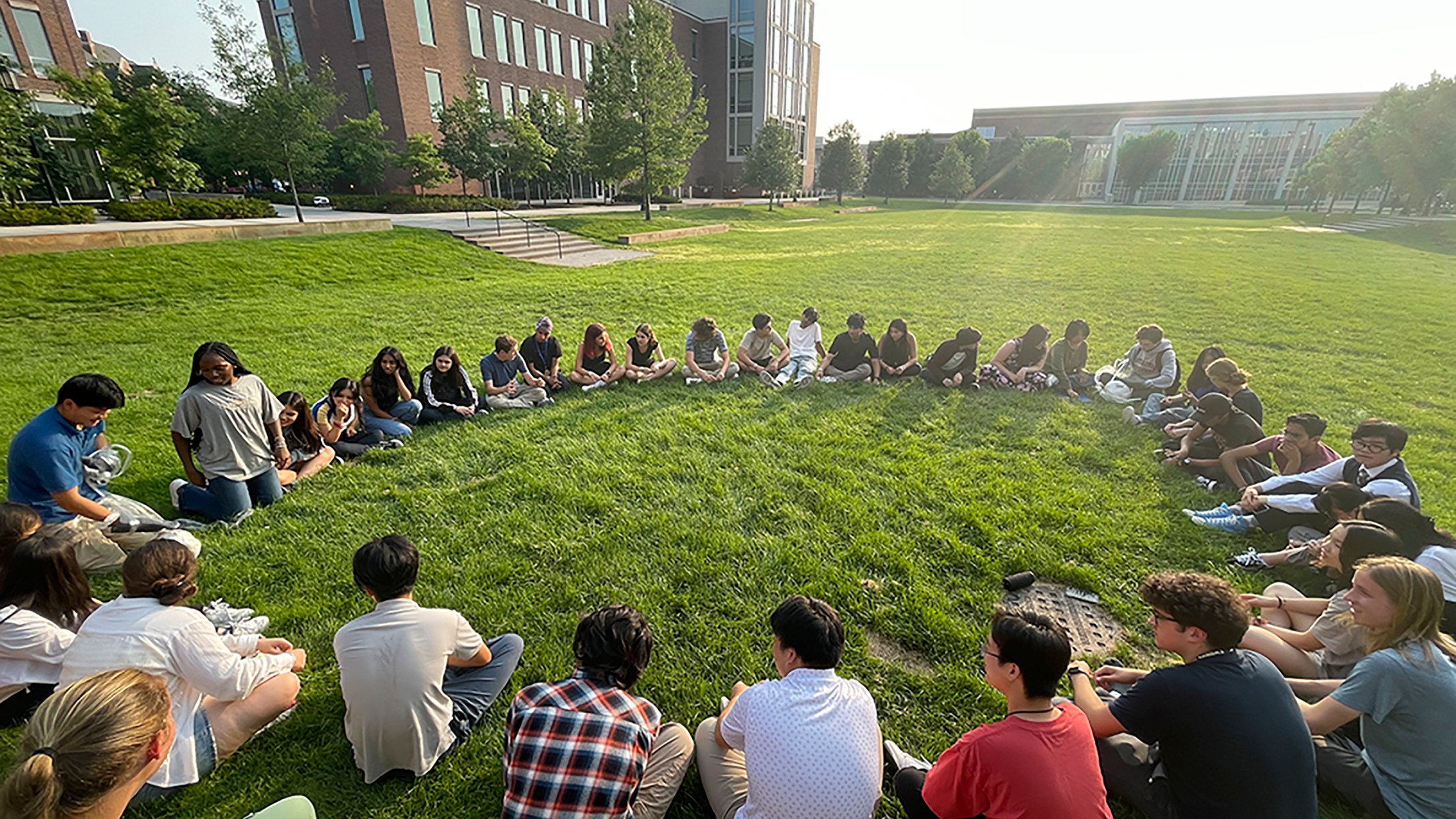 Participants in the Summer Science Program sit in a circle at Purdue University in West Lafayette, Ind., on July 21, 2023. SSP has puzzled over what do to with a surprise bequest of an estimated $200 million — about 100 times its annual budget. (Christin Latus, Summer Science Program via AP Photo)