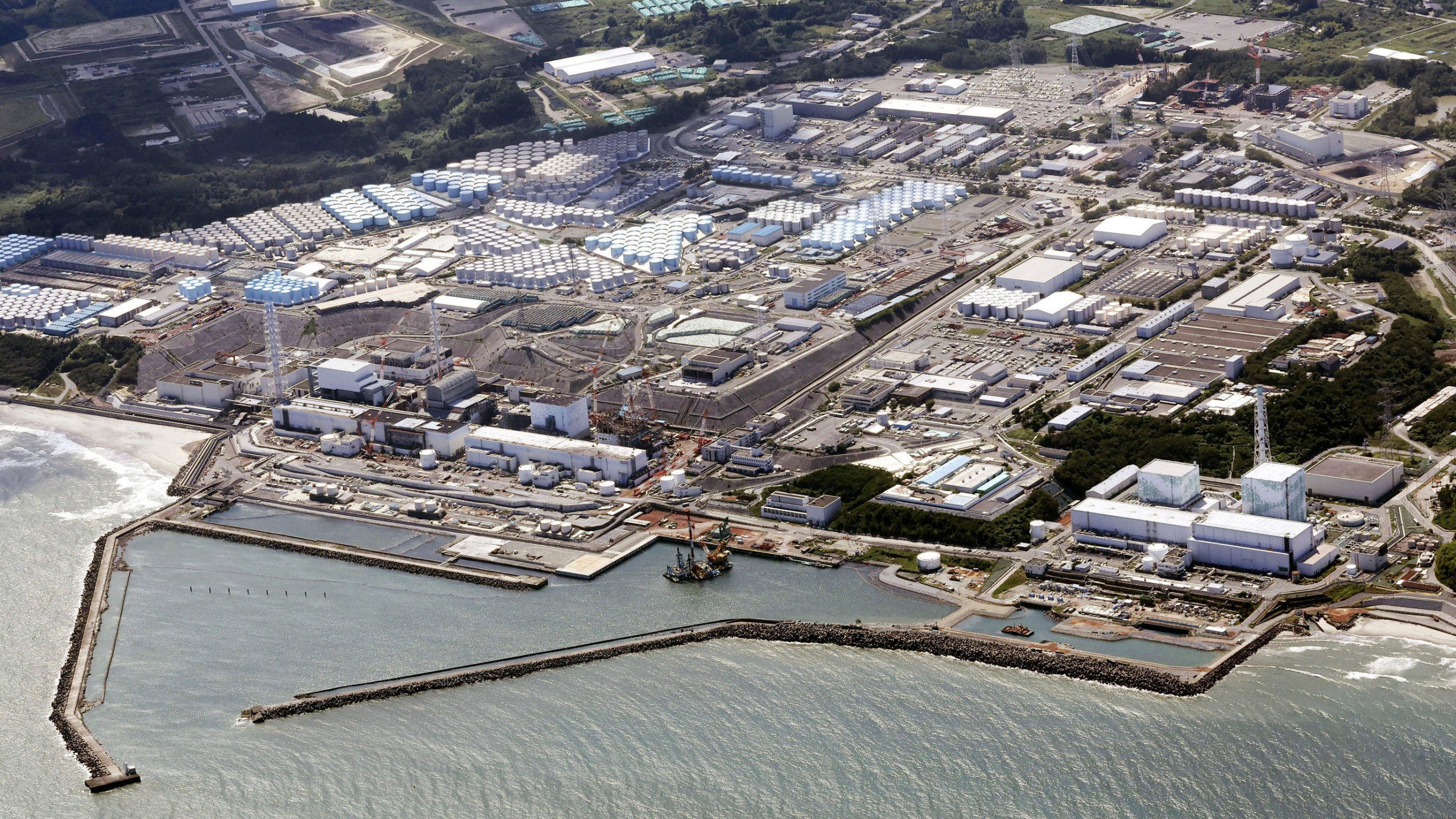 FILE - This aerial view shows the Fukushima Daiichi nuclear power plant in Fukushima, northern Japan, on Aug. 24, 2023, shortly after its operator Tokyo Electric Power Company Holdings TEPCO began releasing its first batch of treated radioactive water into the Pacific Ocean. The tsunami-damaged Fukushima Daiichi nuclear power plant began its third release of treated and diluted radioactive wastewater into the sea Thursday, Nov. 2, 2023 after Japanese officials said the two earlier releases ended smoothly. (Kyodo News via AP, File)