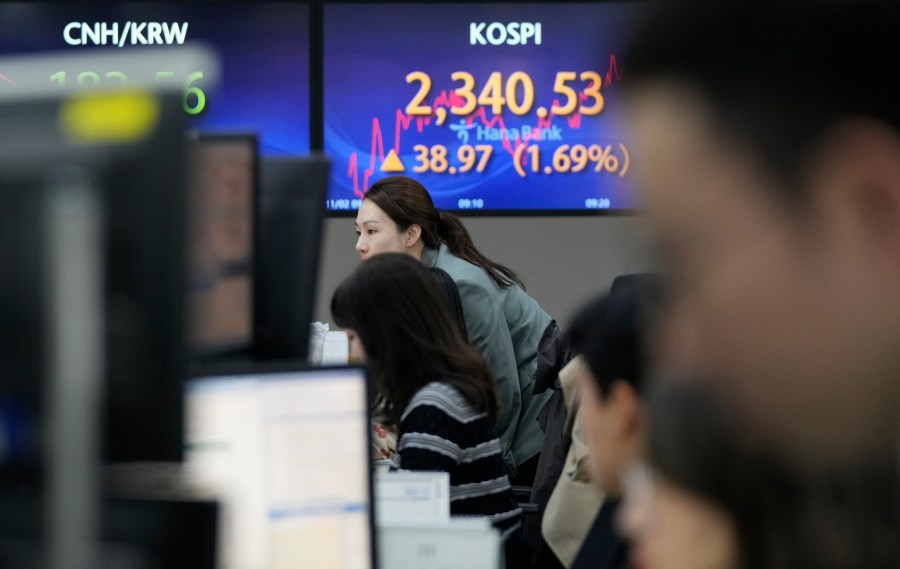 A currency trader watches monitors at the foreign exchange dealing room of the KEB Hana Bank headquarters in Seoul, South Korea, Thursday, Nov. 2, 2023. Asian shares were mostly higher Thursday after the U.S. Federal Reserve indicated it may not need to pump the brakes any harder on Wall Street and the economy. (AP Photo/Ahn Young-joon)