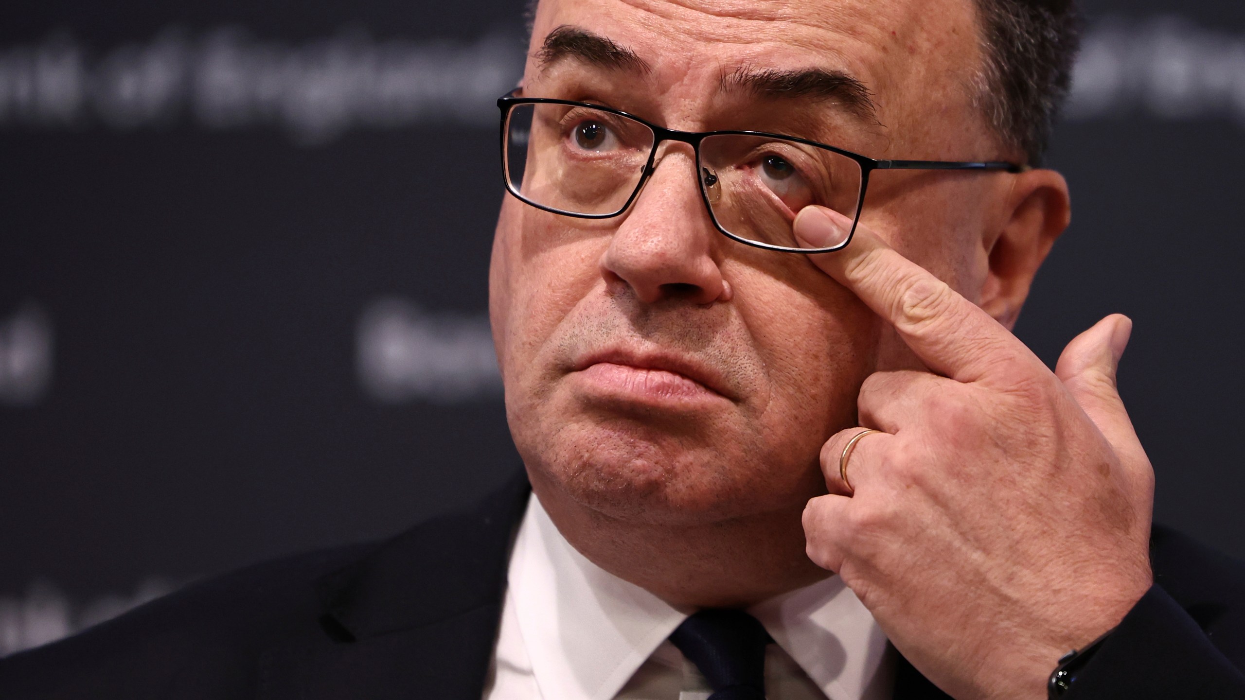 Governor of the Bank of England Andrew Bailey touches his eye as he arrives to address the media during a press conference concerning interest rates, at the Bank of England, in London, Thursday, Nov. 2, 2023. The Bank of England kept its main interest rate unchanged on Thursday at the 15-year high of 5.25% and indicated that borrowing costs will likely remain at these sort of elevated levels for a while, especially if oil and gas prices increase sharply in light of the conflict between Israel and Hamas. (Henry Nicholls/Pool Photo via AP)