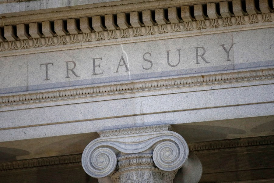 FILE- The U.S. Treasury Department building is shown at dusk in Washington on June 6, 2019. The United States on Thursday imposed a new round of sanctions on roughly 130 firms and people from Turkey to China to the United Arab Emirates in an effort to choke off Moscow’s access to tools and equipment that support its invasion of Ukraine. (AP Photo/Patrick Semansky, File)